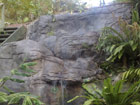 Running water falls over hand crafted rock